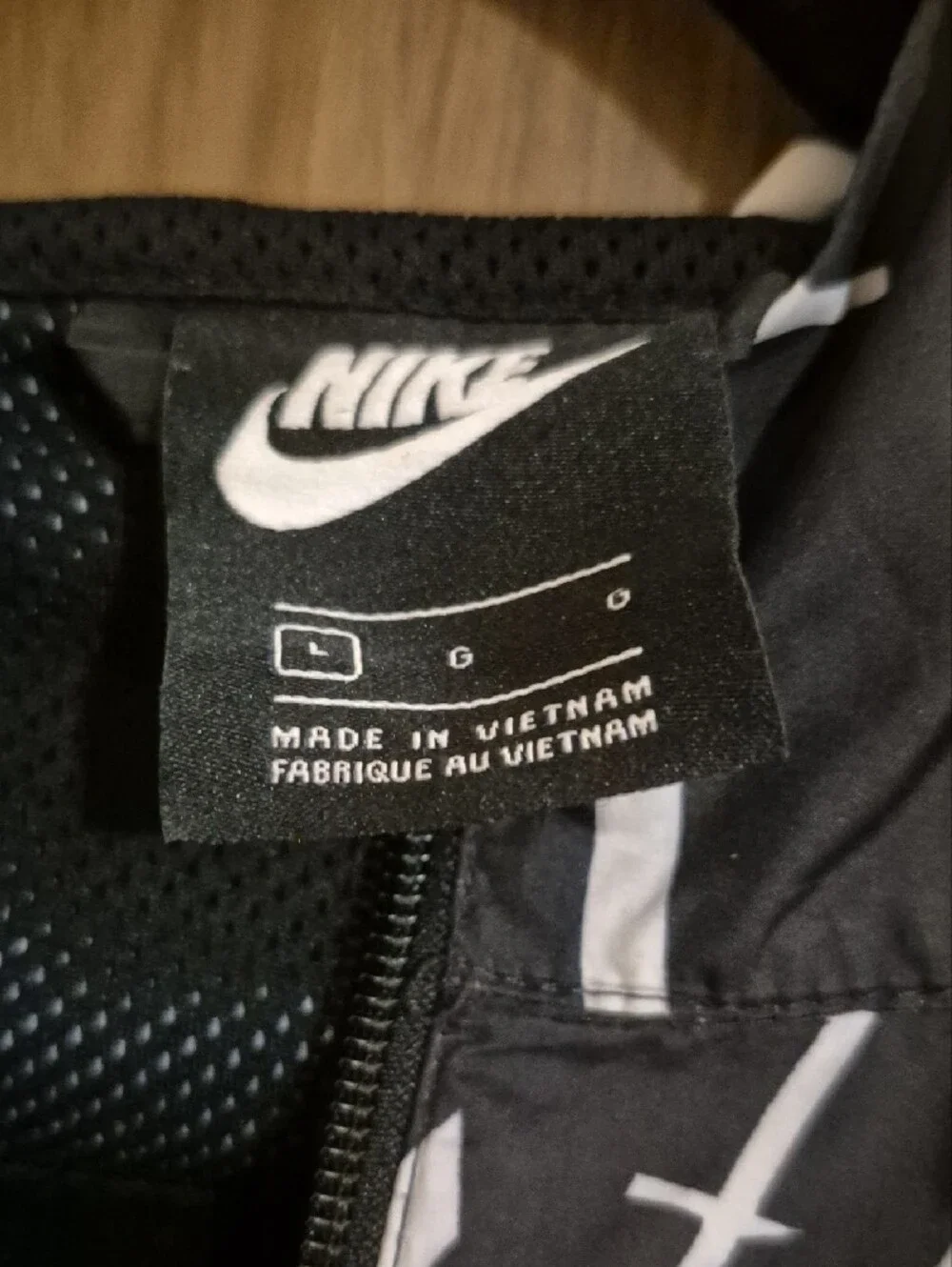 Nike Kids Black Hooded Windbreaker Jacket with White Script Accent